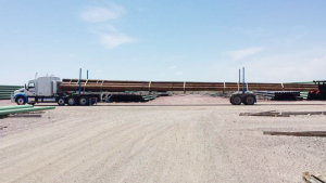 truck hauling wood logs at Adams Industries